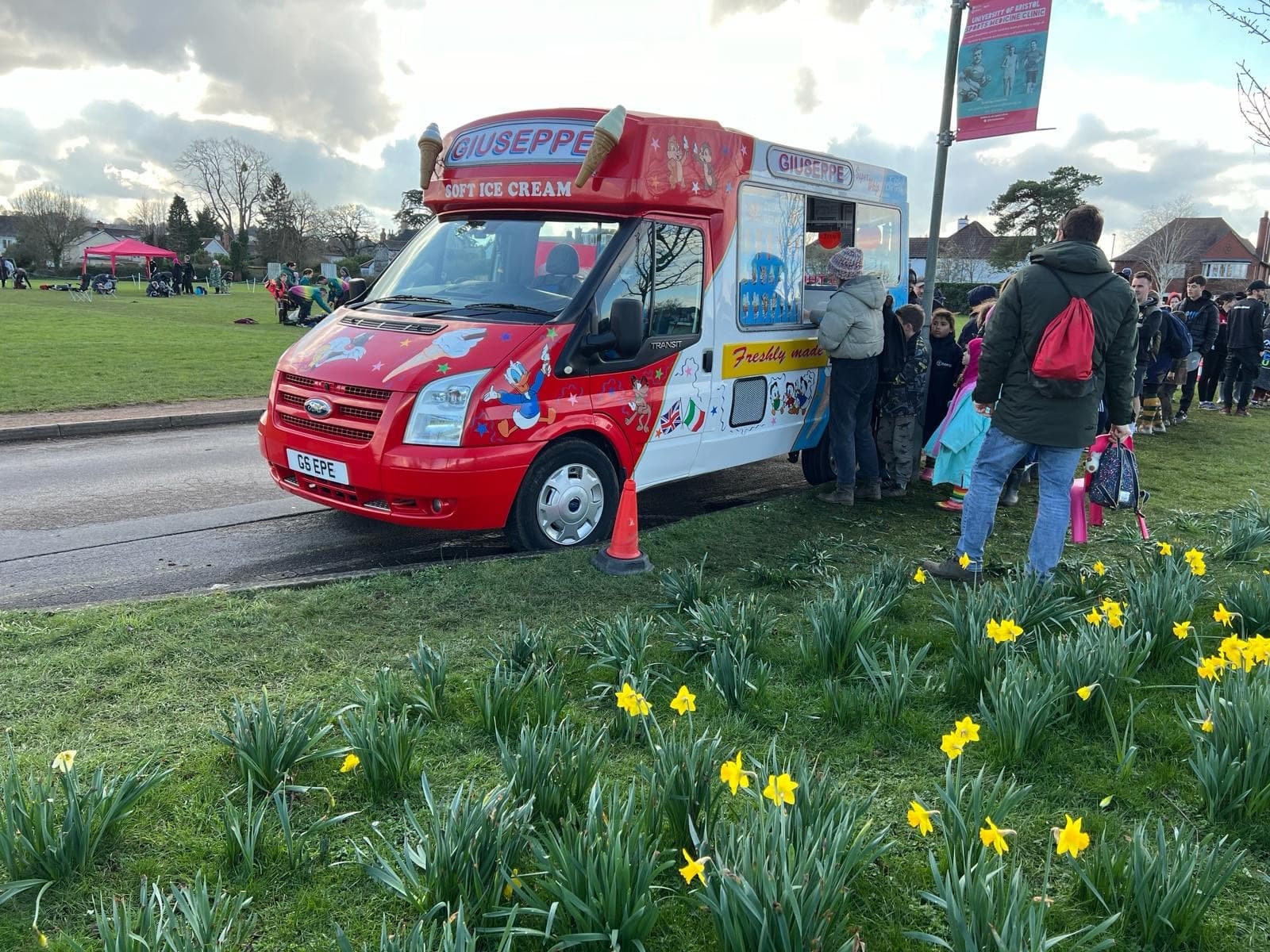 A queue of people waiting at the ice cream van in Bristol A queue of people waiting at the ice cream van in Bristol